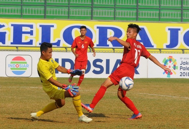 U16 Việt Nam (áo đỏ) bị loại từ vòng bảng. (Nguồn: VFF)