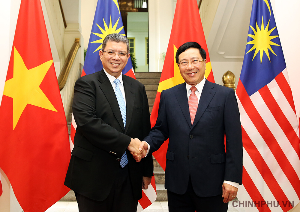 Phó thủ tướng, Bộ trưởng Ngoại giao Phạm Bình Minh và  Bộ trưởng Ngoại giao Malaysia Saifuddin Abdullah. Ảnh: VGP/Hải Minh