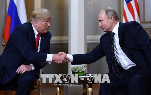 Tổng thống Nga Vladimir Putin (phải) và Tổng thống Mỹ Donald Trump. Ảnh tư liệu: AFP/TTXVN