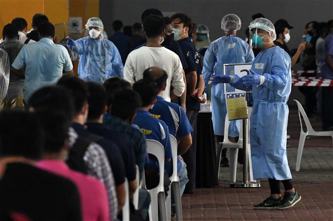 Một điểm xét nghiệm COVID-19 tại Singapore. Ảnh: AFP/TTXVN