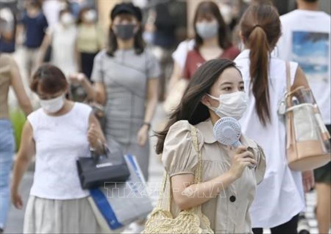 Thế giới gần 31 triệu ca bệnh Người dân đeo khẩu trang phòng dịch COVID-19 tại Tokyo, Nhật Bản ngày 27-8. Ảnh: Kyodo/TTXVN