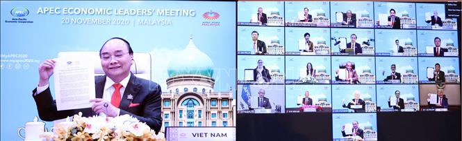 Thủ tướng Nguyễn Xuân Phúc và lãnh đạo các nền kinh tế thành viên thông qua "Tầm nhìn APEC Putrajaya 2040" (ảnh chụp màn hình TV). Ảnh: Thống Nhất/TTXVN