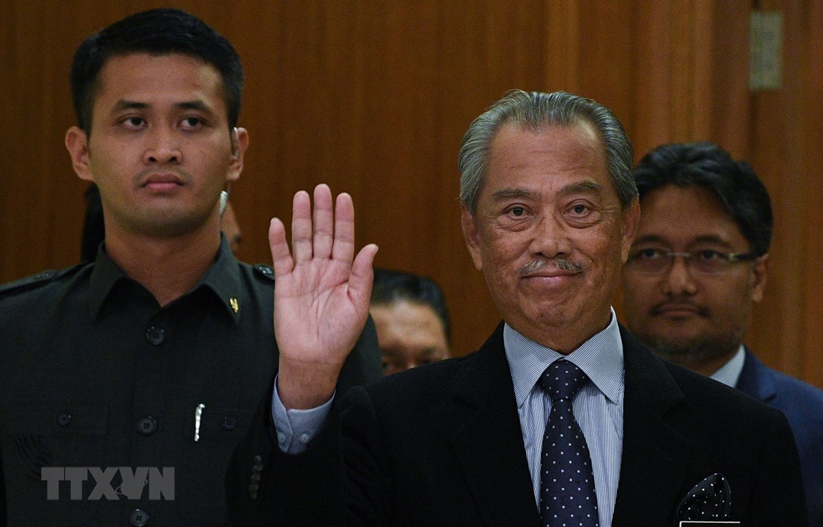 Thủ tướng Malaysia Muhyiddin Yassin (phải) tại một sự kiện ở Putrajaya ngày 9-3-2020. Ảnh: AFP/ TTXVN