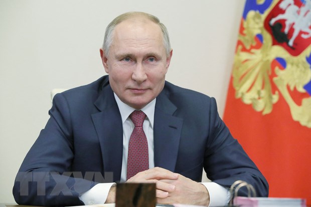 Tổng thống Nga Vladimir Putin trong một cuộc họp trực tuyến tại Novo-Ogaryovo, ngoại ô Moskva. (Ảnh: AFP/TTXVN)