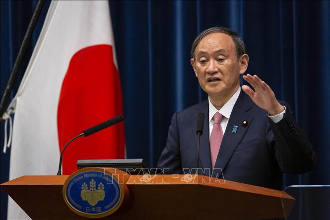 Thủ tướng Nhật Bản Suga Yoshihide phát biểu tại cuộc họp báo ở Tokyo ngày 14-5-2021. Ảnh: AFP/TTXVN