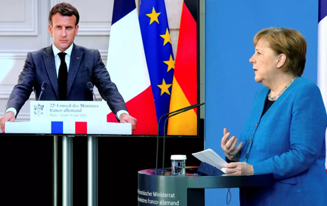 Tổng thống Pháp Emmanuel Macron và Thủ tướng Đức Angela Merkel cùng tham gia một cuộc họp báo chung trực tuyến ngày 31-5-2021. Ảnh: Reuters