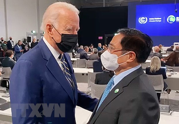 Thủ tướng Phạm Minh Chính gặp Tổng thống Hoa Kỳ Joe Biden tại Hội nghị. Ảnh: TTXVN