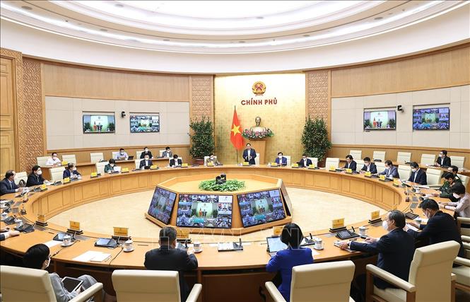 Thủ tướng chủ trì họp trực tuyến với 63 tỉnh, thành phố về phòng, chống dịch COVID-19 Quang cảnh cuộc họp tại điểm cầu Chính phủ. Ảnhh: Dương Giang/TTXVN