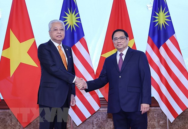 Thủ tướng Phạm Minh Chính và Thủ tướng Malaysia Dato’ Sri Ismail Sabri bin Yaakob chụp ảnh chung. Ảnh: Dương Giang/TTXVN