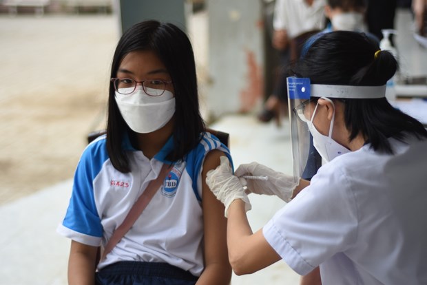 Tiêm vaccine phòng COVID-19 cho trẻ em. Ảnh: Lê Xuân/TTXVN