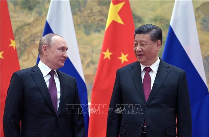 Tổng thống Nga Vladimir Putin (trái) và Chủ tịch Trung Quốc Tập Cận Bình tại cuộc gặp ở Bắc Kinh, ngày 4-2-2022. Ảnh tư liệu: AFP/TTXVN 