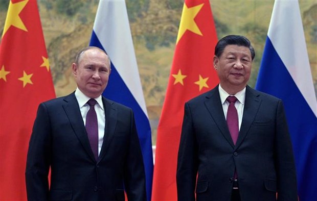 Chủ tịch Trung Quốc Tập Cận Bình (phải) và Tổng thống Nga Vladimir Putin tại cuộc gặp ở Bắc Kinh (Trung Quốc), ngày 4-2-2022. (Ảnh: AFP/TTXVN)