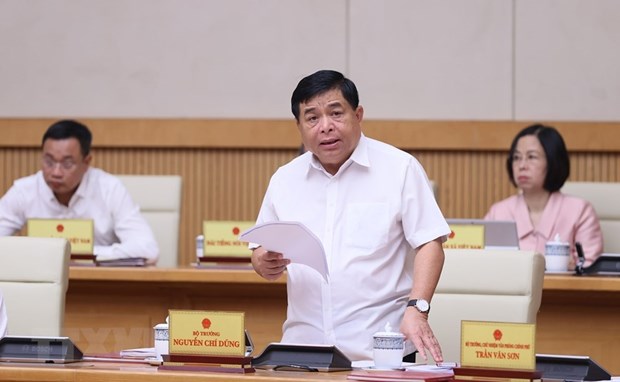 Bộ trưởng Bộ Kế hoạch và Đầu tư Nguyễn Chí Dũng báo cáo tình hình kinh tế-xã hội 8 tháng năm 2023. (Ảnh: Dương Giang/TTXVN)