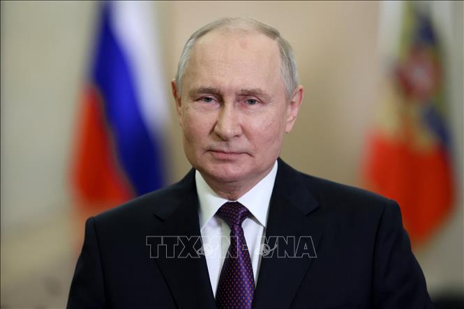 Tổng thống Vladimir Putin đồng ý tham gia tái tranh cử trong cuộc bầu cử tổng thống sắp tới. Ảnh: AFP/TTXVN